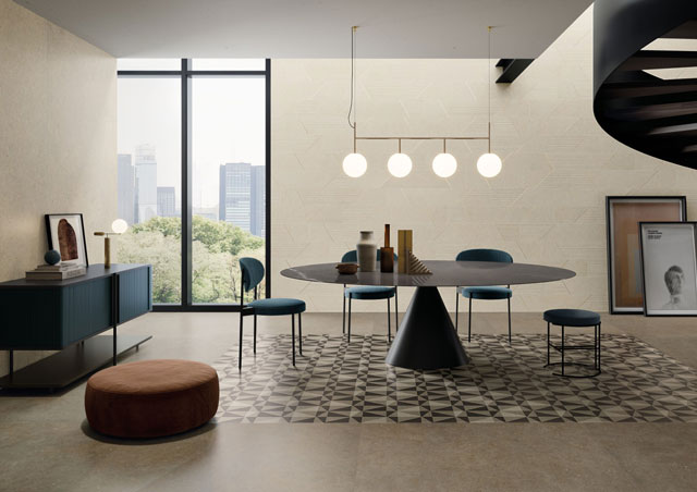 Modernes gefliestes Esszimmer mit schwarzem Tisch, blauen Stühlen und geometrischem Bodenmuster